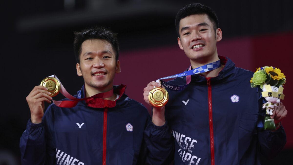 Gold medalists Lee Yang of Taiwan and Wang Chi-Lin of Taiwan pose with their men's doubles badminton gold medals at the medal ceremony at the Tokyo 2020 Olympics in Musashino Forest Sport Plaza in Tokyo, Japan, on July 31, 2021. (Leonhard Foeger/Reuters)