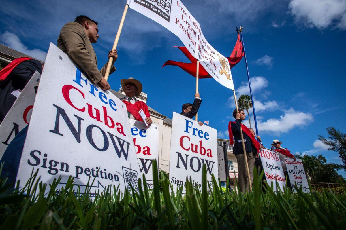 People participate in a vigil to show their support for Cubans demonstrating against their government, at the Hialeah Park Casino in Miami on July 26, 2021. (Giorgio Viera/AFP via Getty Images)