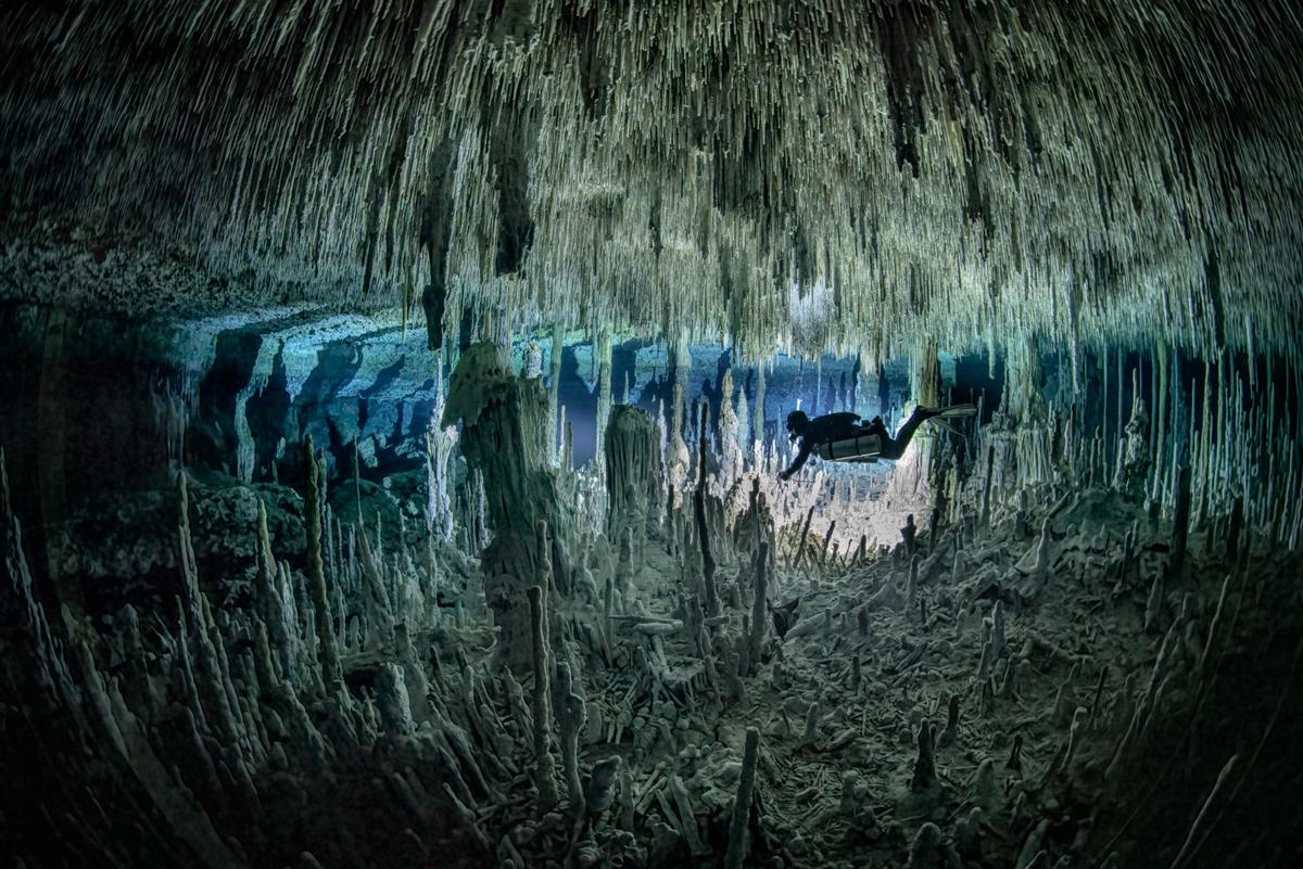 Stalactites and stalagmites preserved perfectly underwater. (Caters News)