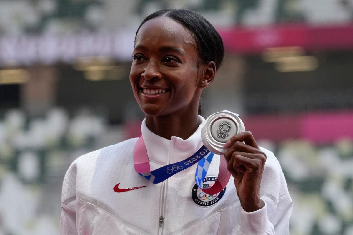 Silver medalist Dalilah Muhammad, of the United States, poses during the medal ceremony for the women's 400-meter hurdles at the 2020 Summer Olympics in Tokyo, Japan, on Aug. 4, 2021. (Francisco Seco/AP Photo)