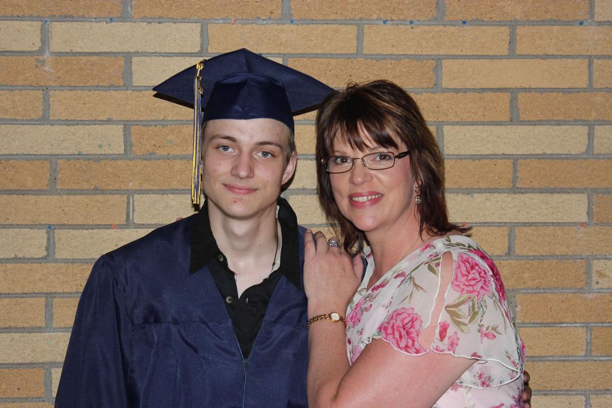 Ben with his mom at his high-school graduation. (Courtesy of Ann Brigham Chrudinsky)