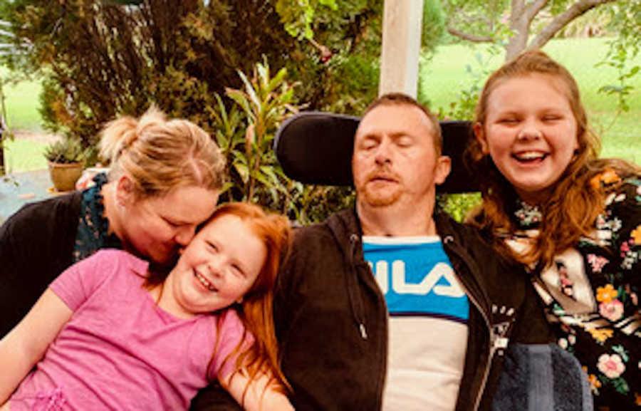 Victorija and Paul with their daughters. (Courtesy of <a href="https://www.facebook.com/thecarefactor.tbi/">The Care Factor</a>)