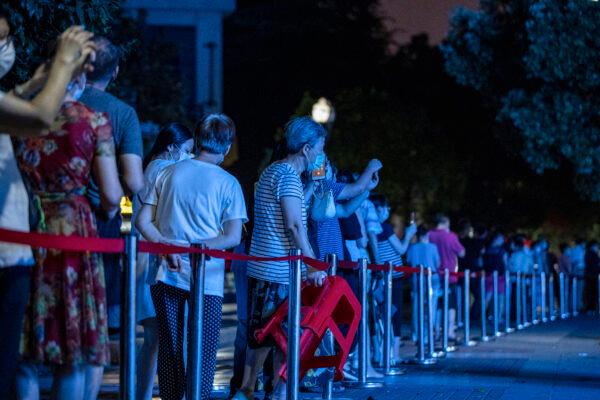 Residents line up to test for the CCP virus in Wuhan in China's central Hubei Province on Aug. 3, 2021. (STR/AFP via Getty Images)