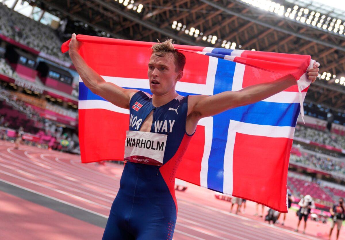 Karsten Warholm of Team Norway celebrates after winning the gold medal in the men's 400-meter hurdles on day 11 of the Tokyo 2020 Olympic Games at Olympic Stadium in Tokyo, on Aug. 3, 2021. (Matthias Schrader/Pool/Getty Images)