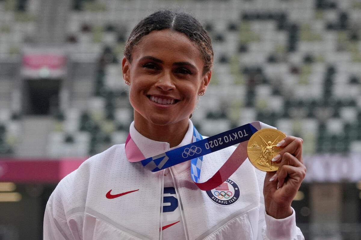 Gold medalist Sydney McLaughlin, of the United States, poses during the medal ceremony for the women's 400-meter hurdles at the 2020 Summer Olympics in Tokyo, Japan, on Aug. 4, 2021. (Francisco Seco/AP Photo)