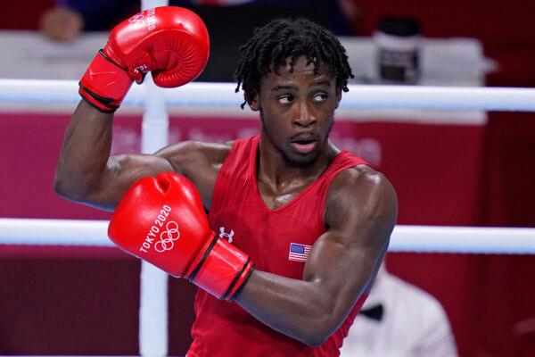 The United States' Keyshawn Davis celebrates after winning a men's lightweight 63-kg quarterfinal boxing match against Russian Olympic Committee's Gabil Mamedov at the 2020 Summer Olympics, in Tokyo, Japan, on Aug. 3, 2021. (Frank Franklin II/AP Photo)