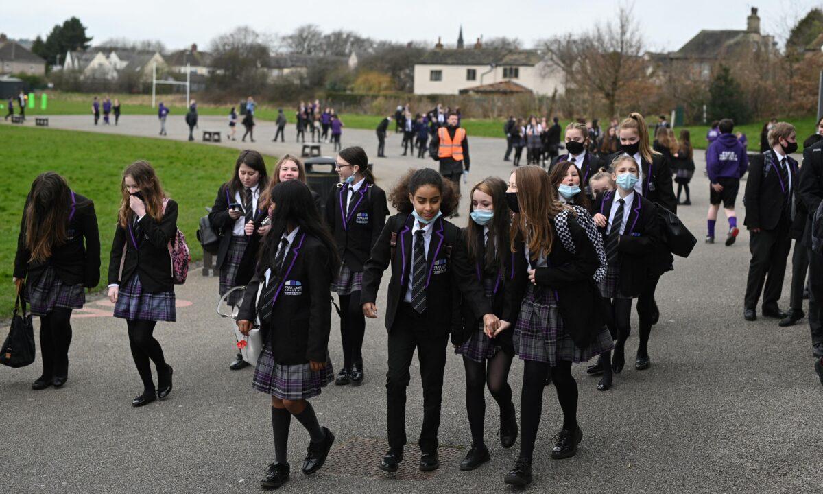 Students take a break between classes at Park Lane Academy in Halifax, northwest England on March 17, 2021. (Oli Scarff/AFP via Getty Images)