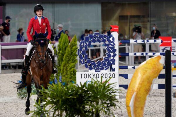 United States' Jessica Springsteen, riding Don Juan van de Donkhoeve, enters the arena to compete during the equestrian jumping individual competition during the 2020 Summer Olympics, in Tokyo on Aug. 3, 2021. (Carolyn Kaster/AP Photo)