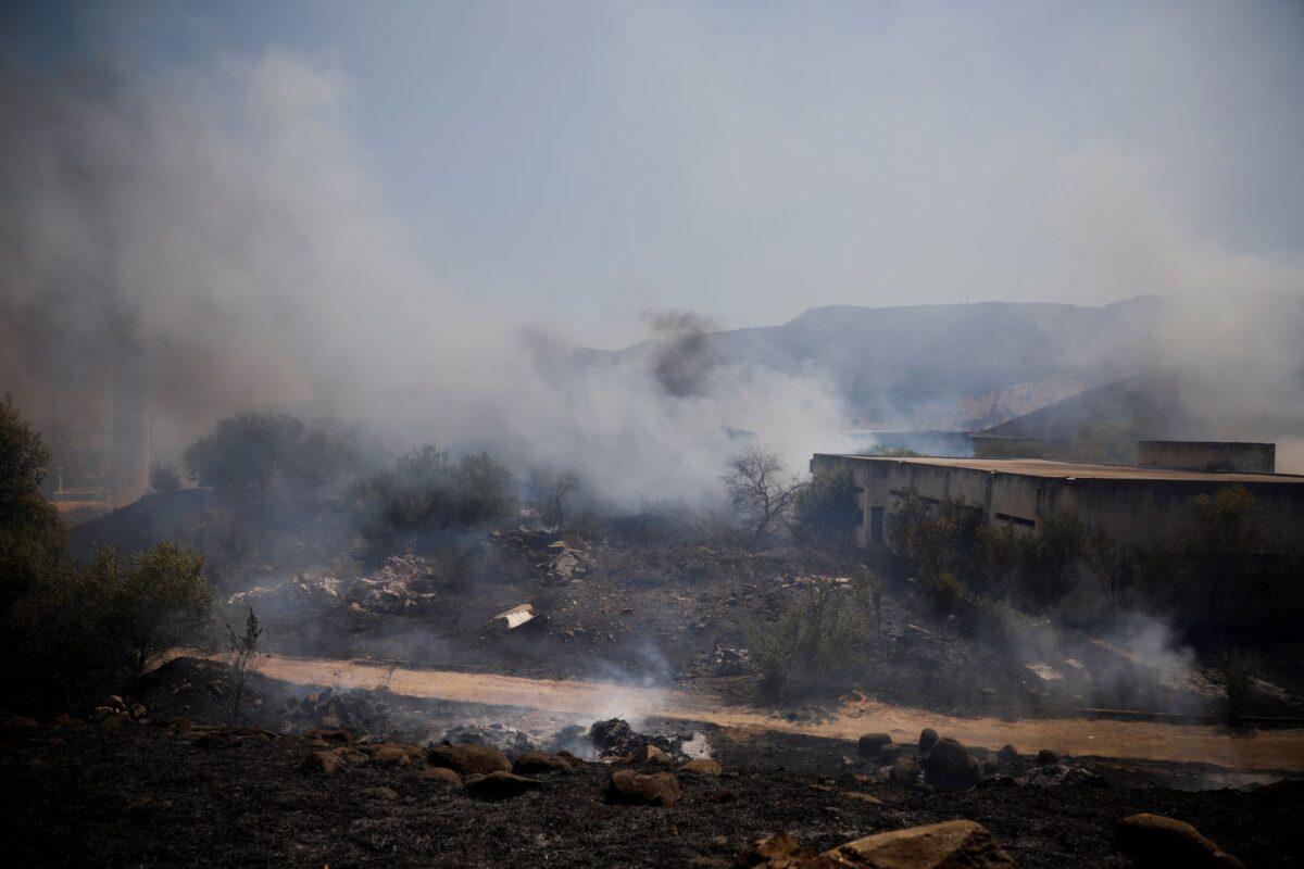 Fields burn following a hit by a rocket fired from Lebanon into Israeli territory, near the northern Israeli town of Kiryat Shmona, on Aug. 4, 2021. (Ariel Schalit/AP Photo)