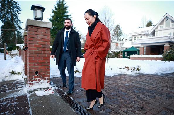 Huawei Technologies Chief Financial Officer Meng Wanzhou leaves her house on her way to a court appearance in Vancouver, Canada, on Jan. 17, 2020. The United States government accused Wanzhou of fraud after HSBC continued trade with Iran while sanctions were in place. (Jeff Vinnick/Getty Images)