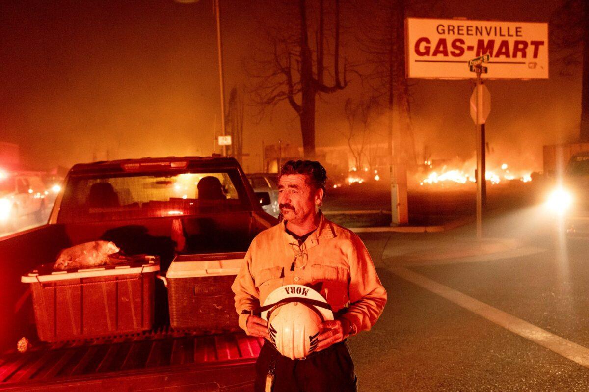 Battalion Chief Sergio Mora watches as the Dixie Fire tears through the Greenville community in Plumas County, Calif., on Aug. 4, 2021. (Noah Berger/AP Photo)