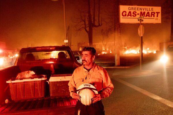 Battalion Chief Sergio Mora watches as the Dixie Fire tears through the Greenville community of Plumas County, Calif., on Aug. 4, 2021. (Noah Berger/AP Photo)
