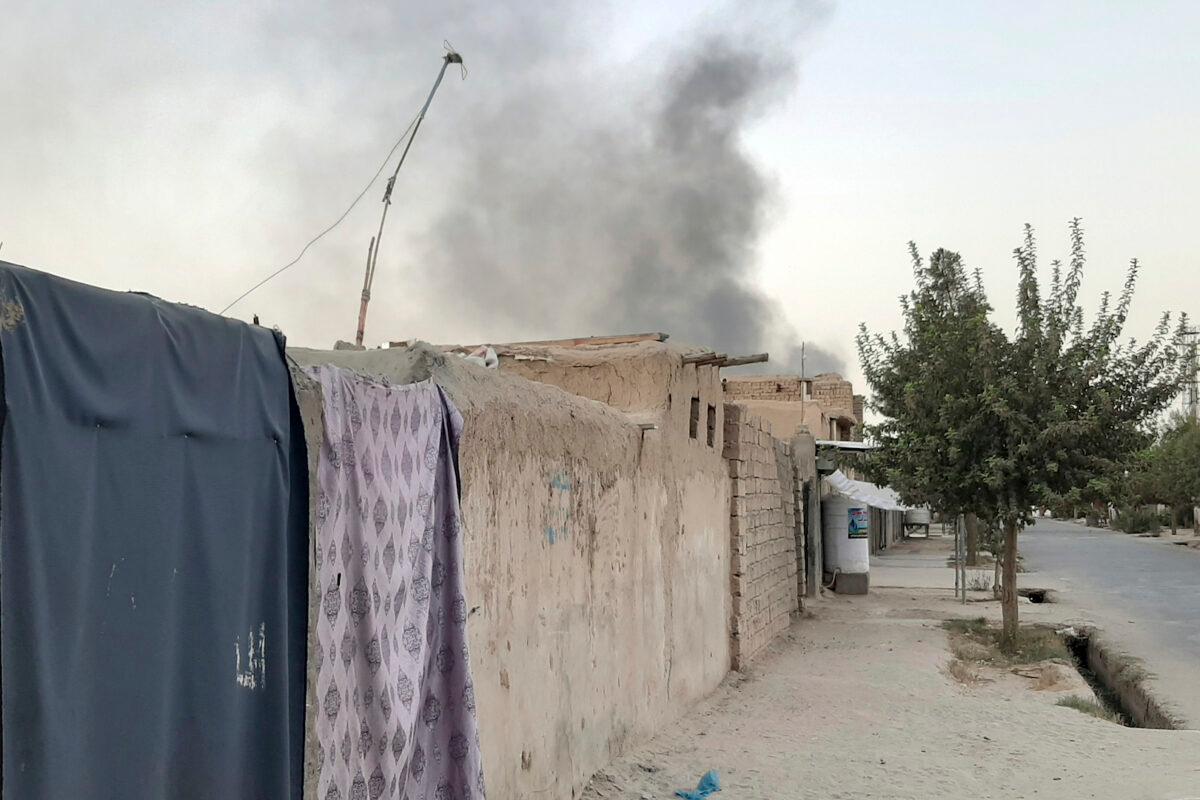 Smoke rises from the city of Lashkar Gah after an airstrike against the Taliban in Helmand province south of Kabul, Afghanistan on Aug. 6, 2021. (Abdul Khaliq/AP Photo)