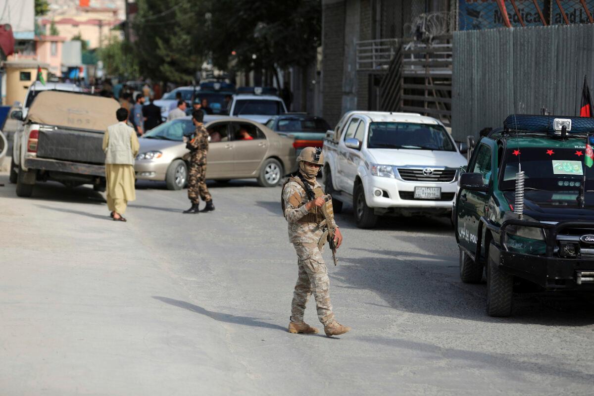 Afghan security personnel arrives at the area where the director of Afghanistan's government information media center Dawa Khan Menapal was shot dead in Kabul, on Aug. 6, 2021. (Rahmat Gul/AP Photo)