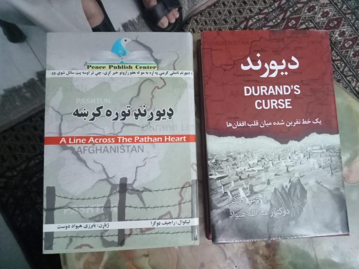 Dari and Pashto (Afghan languages) editions of the book, "Durand's Curse: A Line Across the Pathan Heart" by Amb. Rajiv Dogra. (Venus Upadhayaya/Epoch Times)