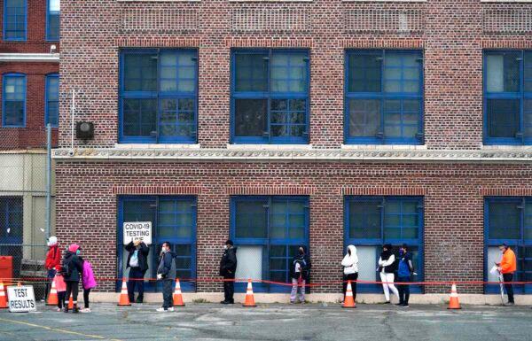 People wait in line to get tested for COVID-19 at the Ann Street School Covid-19 Testing Center in Newark, New Jersey on Nov.12, 2020. (Timothy A. Clary/AFP via Getty Images)