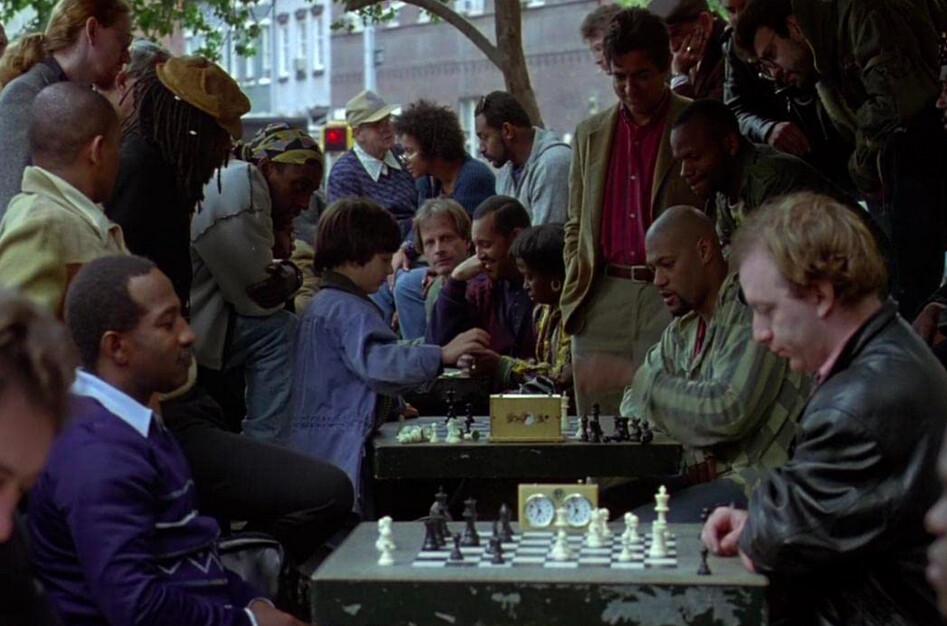 Josh Waitzkin (Max Pomeranc, middle L) and Vinnie, a chess hustler (Laurence Fishburne), in “Searching for Bobby Fischer.” (Paramount Pictures)