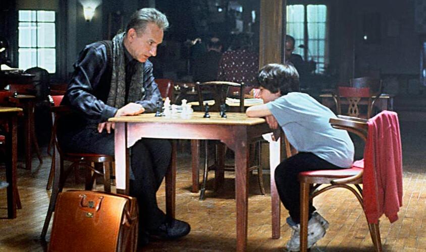 Bruce Pandolfini (Ben Kingsley, L) and Josh Waitzkin (Max Pomeranc) are chess coach and pupil, in “Searching for Bobby Fischer.” (Paramount Pictures)