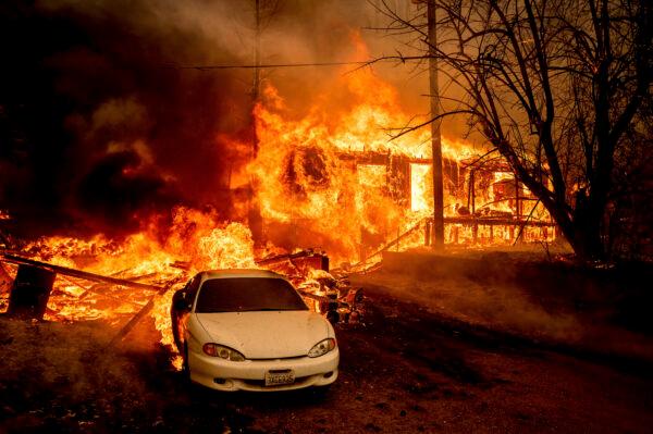 Flames from the Dixie Fire consume a home on Highway 89 south of Greenville in Plumas County, Calif., on Aug. 5, 2021. (Noah Berger/AP Photo)
