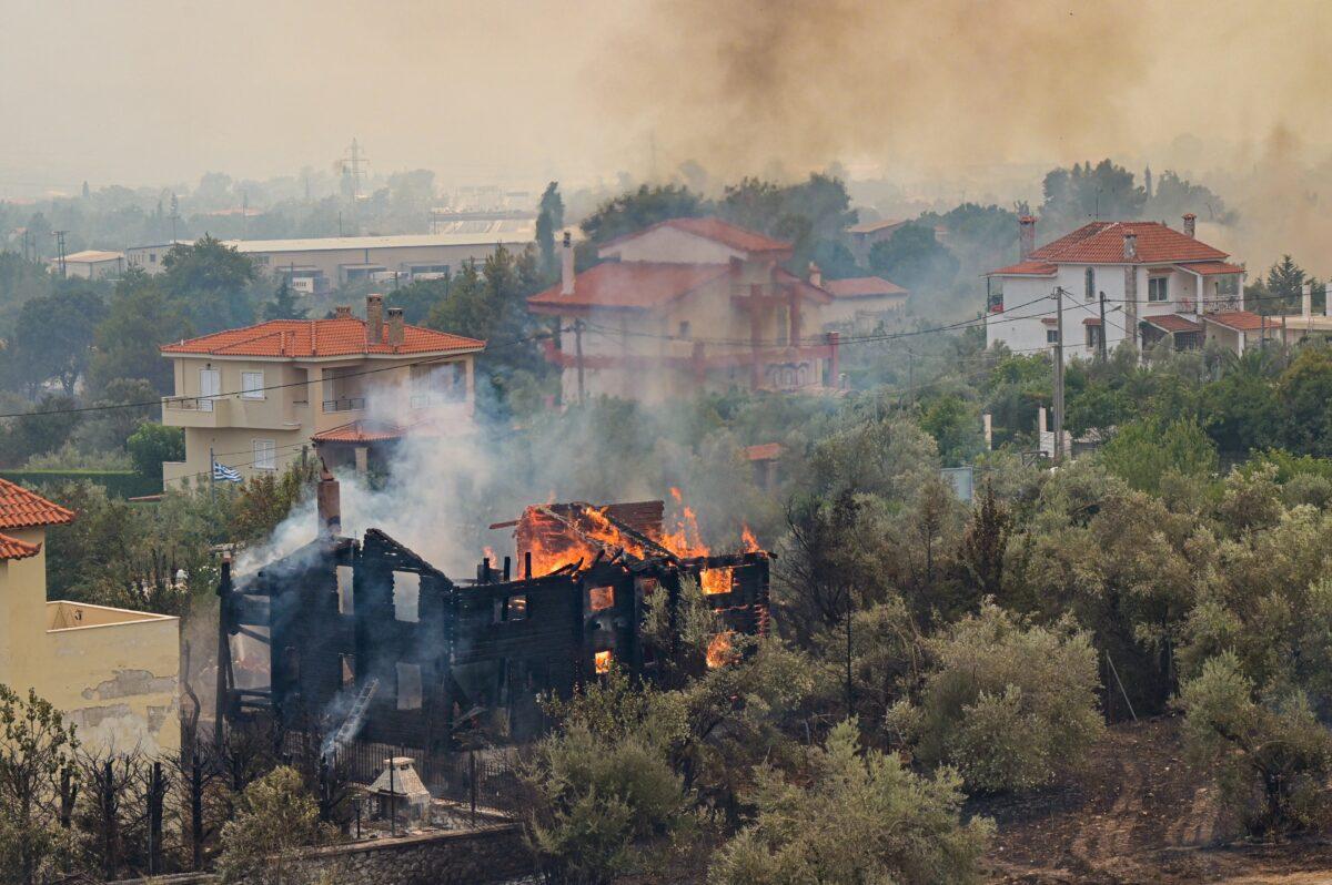 A house on fire in the Afidnes area, northern Athens, in Athens, Greece, on Aug. 6, 2021. (Milos Bicanski/Getty Images)