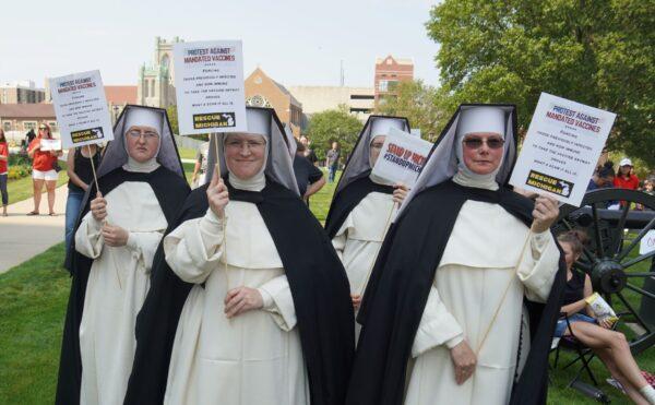 These four freedom-loving nuns turned out to stand against the medical tyranny of forced vaccinations at a protest rally on the grounds of the State Capitol in Lansing, Michigan on August 6, 2021. (Steven Kovac/Epoch Times)