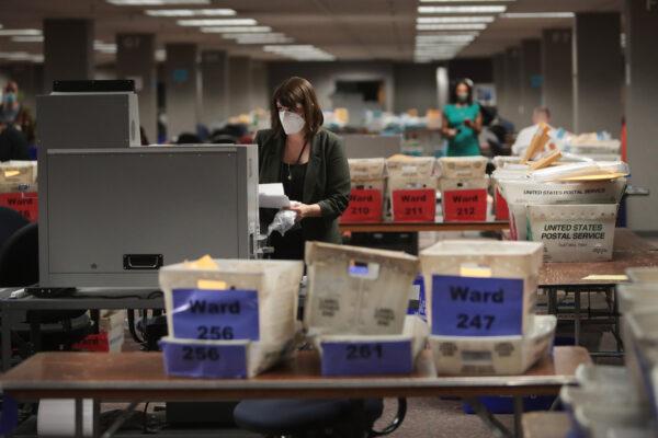 Claire Woodall-Vogg, executive director of the Milwaukee Election Commission, collects the count from absentee ballots in Milwaukee on Nov. 4, 2020. (Scott Olson/Getty Images)