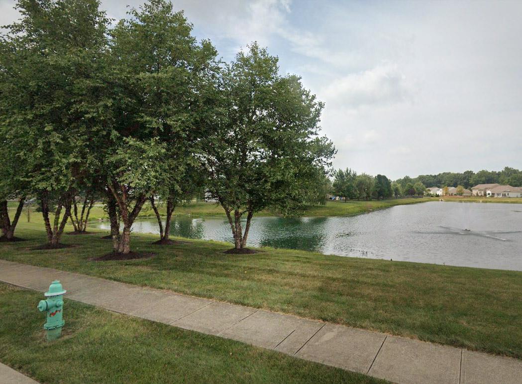 A pond in The Bristols in Fishers, Indiana. (Screenshot/<a href="https://www.google.com/maps/@39.9737485,-85.9521237,3a,60y,279.16h,90t/data=!3m6!1e1!3m4!1siuSGo4nOCDUzM0yqX_GpDA!2e0!7i16384!8i8192">Google Maps</a>)