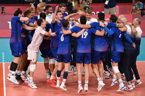 France's players celebrate their victory in the men's gold medal volleyball match between France and Russia during the Tokyo 2020 Olympic Games at Ariake Arena in Tokyo, Japan, on Aug. 7, 2021. (Jung Yeon-je/AFP via Getty Images)