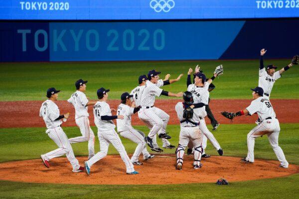 Team Japan celebrate after the gold medal baseball game against the United States at the 2020 Summer Olympics, in Yokohama, Japan, Aug. 7, 2021. (Jae C. Hong/AP Photo)