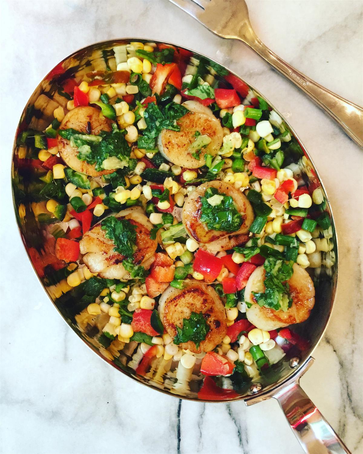 Scallops' natural sweetness is complemented by bright citrus and crisp, sweet corn and bell peppers, which make them a delightful summer meal. (Lynda Balslev for Tastefood)
