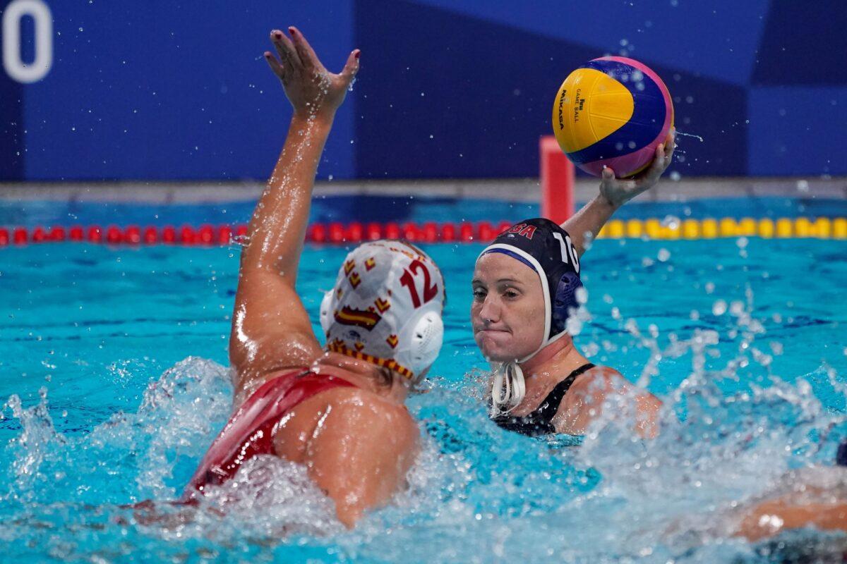 United States' Kaleigh Gilchrist (10) is defended by Spain's Paula Leiton Arrones (12) during the women's water polo gold medal match at the 2020 Summer Olympics, in Tokyo, Japan, on Aug. 7, 2021. (Mark Humphrey/AP Photo)
