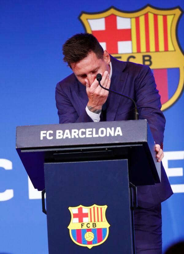 Lionel Messi cries at the start of a press conference at the Camp Nou stadium in Barcelona, Spain, on Aug. 8, 2021. (Joan Monfort/AP Photo)