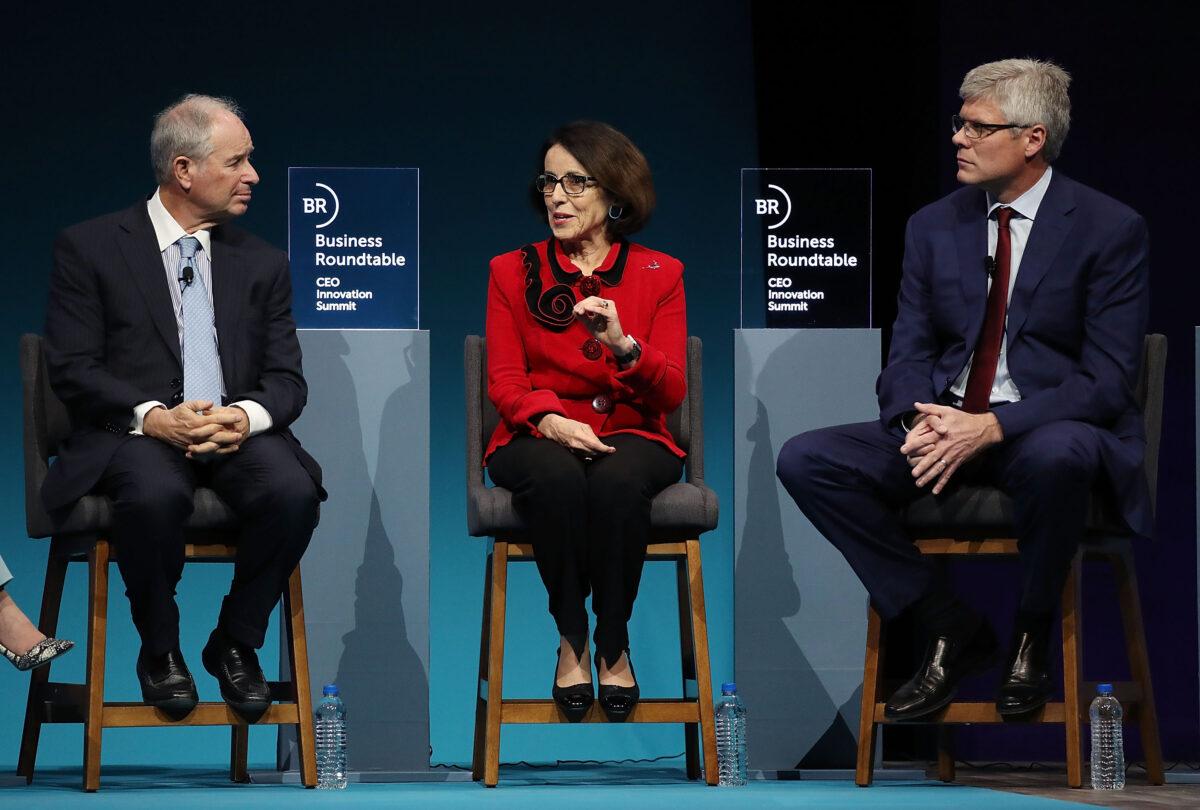 (L-R), Steve Schwarzman, CEO and co-founder of the Blackstone Group, France Cordova, director of the National Science Foundation, and Steve Mollenkopf, CEO of Qualcomm Inc. participate in a roundtable discussion on a CEO Innovation Summit in Washington on Dec. 6, 2018. (Mark Wilson/Getty Images)