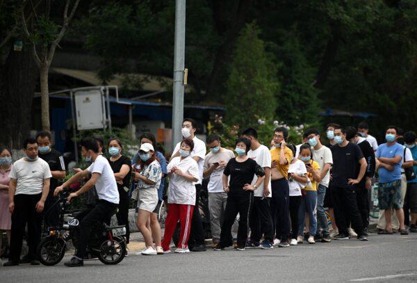 People queue to get tested for COVID-19 at a test site in Beijing, China on Aug. 5, 2021. (Noel Celis/AFP via Getty Images)