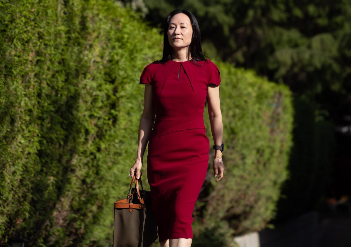 Meng Wanzhou, chief financial officer of Huawei, leaves home to attend her extradition hearing at B.C. Supreme Court, in Vancouver, on Aug. 10, 2021. (The Canadian Press/Darryl Dyck)