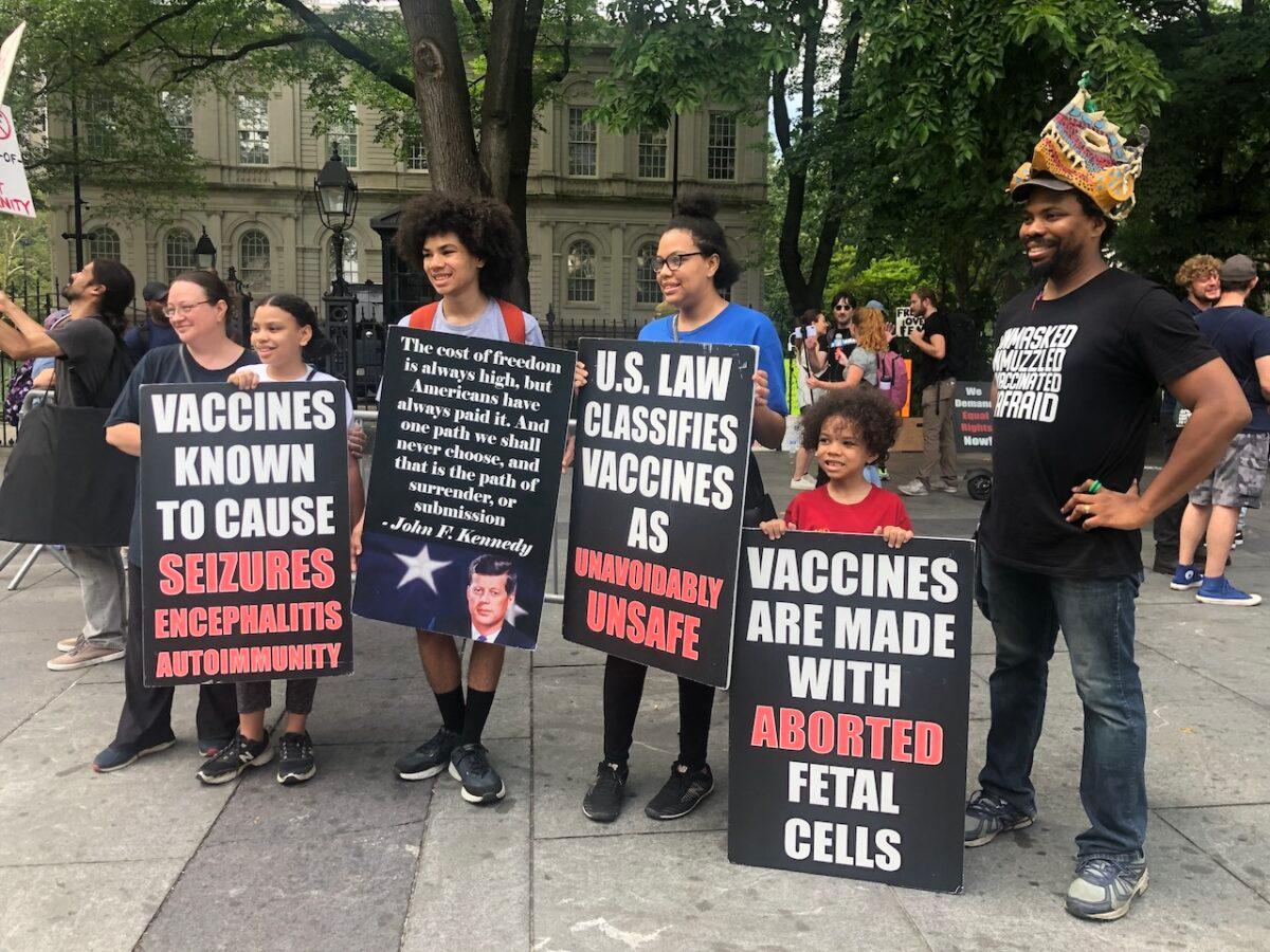 Protestors gather to oppose vaccine passports at New York City Hall on Aug. 9, 2021. (Enrico Trigoso/The Epoch Times)