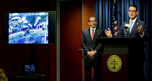 Riverside District Attorney Mike Hestrin (R) discusses the decision not to file charges in the shooting death of a mentally-ill man by the off-duty Los Angeles Police Officer Salvador Sanchez during a news conference in Riverside, Calif., on Sept. 25, 2019. (Terry Pierson/The Orange County Register via AP)