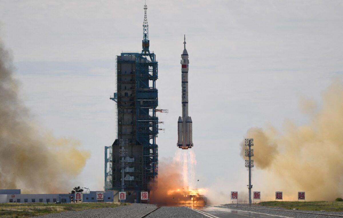 A Long March-2F carrier rocket, carrying the Shenzhou-12 spacecraft and a crew of three astronauts to China's new space station, lifts off from the Jiuquan Satellite Launch Centre in the Gobi desert, in northwest China on June 17, 2021. (Greg Baker/AFP via Getty Images)