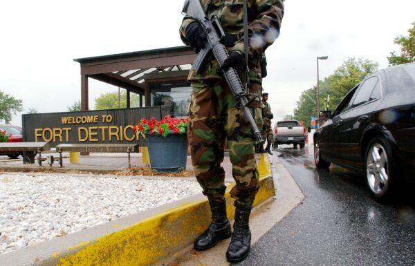Military Personnel stand guard outside the U.S. Army Medical Research Institute of Infectious Diseases at Fort Detrick on Sept. 26, 2002. (Olivier Douliery/AFP via Getty Images)