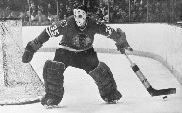 Chicago Blackhawks goalie Tony Esposito moves behind the net to stop the puck for a teammate during an NHL hockey game against the Toronto Maple Leafs in Chicago on Jan. 25, 1970. (AP Photo/Fred Jewell, File)