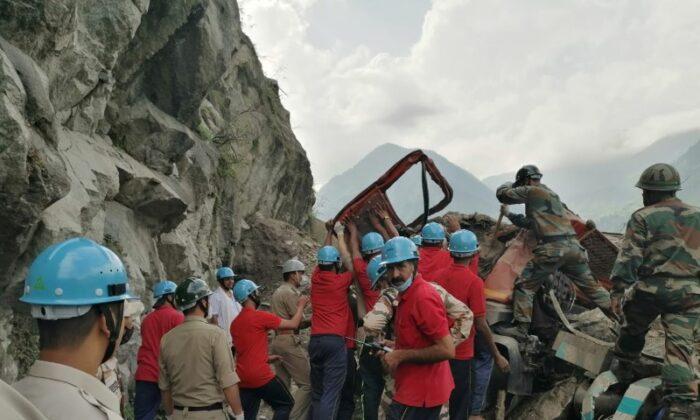 Indo-Tibetan Border Police (ITBP) personnel remove a damaged truck during a rescue operation at the site of a landslide in Kinnaur district in the northern state of Himachal Pradesh, India, on Aug. 11, 2021. (Indo-Tibetan Border Police/Handout via Reuters)