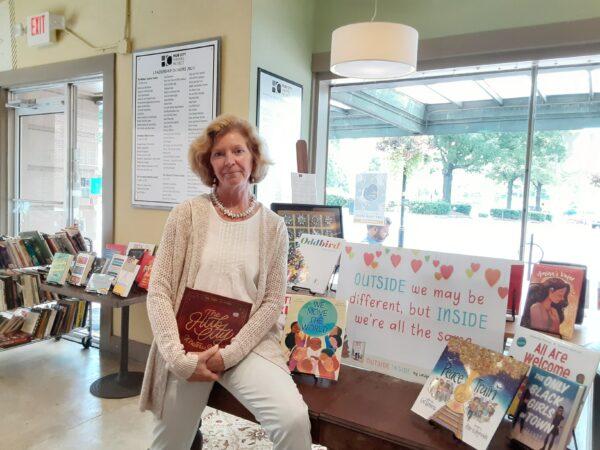 Anne Waters is the executive director at Hub City Bookshop in Spartanburg, S.C. She is holding a special edition of “The Hub City Writers Project,” which chronicles its 25-year history from 1995 to 2020. (Courtesy of Hub City Bookshop)