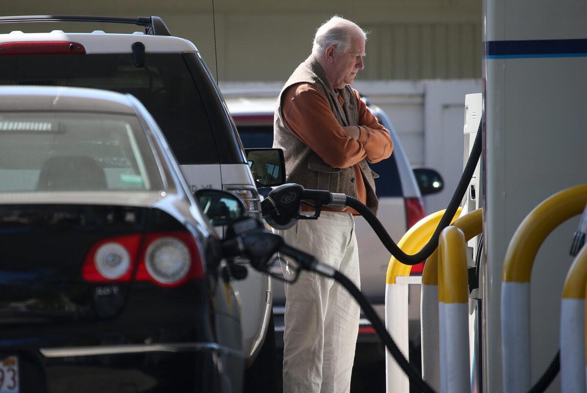 A customer pumping gasoline at an Arco gas station in Mill Valley, Calif., on March 3, 2015. (Justin Sullivan/Getty Images)