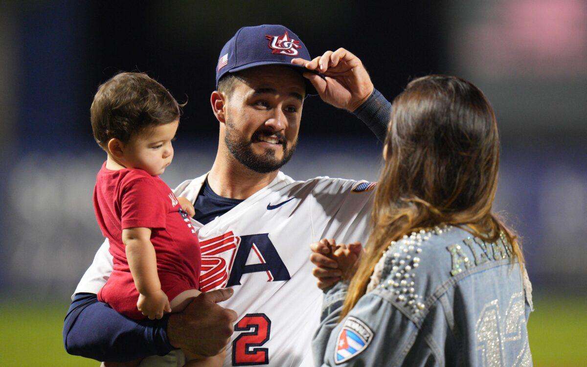 Eddy Alvarez #2 of United States celebrate with his family after qualifying for the Olympics during the WBSC Baseball Americas Qualifier Super Round at Clover Park in Port St. Lucie, Fla., on June 5, 2021. (Mark Brown/Getty Images)