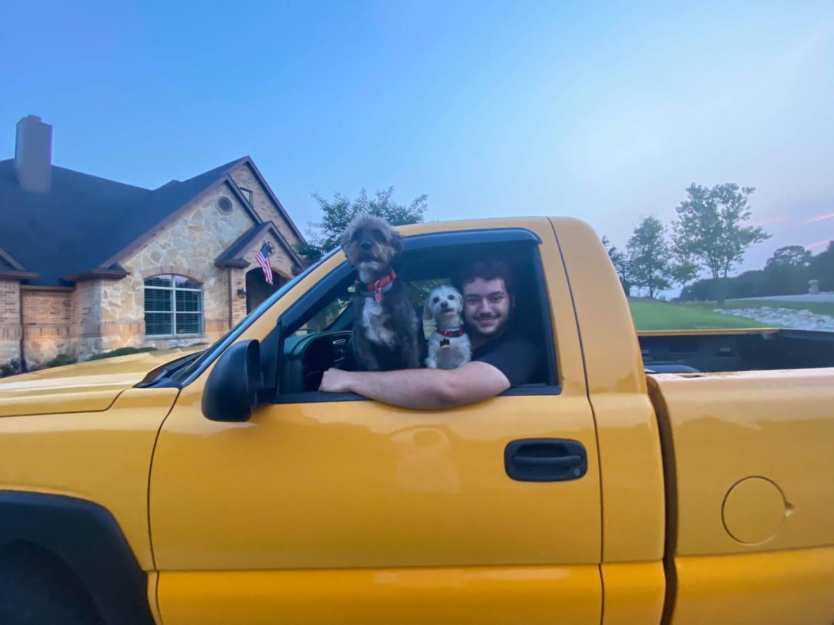 Grayson Elliott with his dogs in his yellow Z71. (Courtesy of <a href="https://www.facebook.com/grayson.elliott.71">Grayson Elliott</a>)