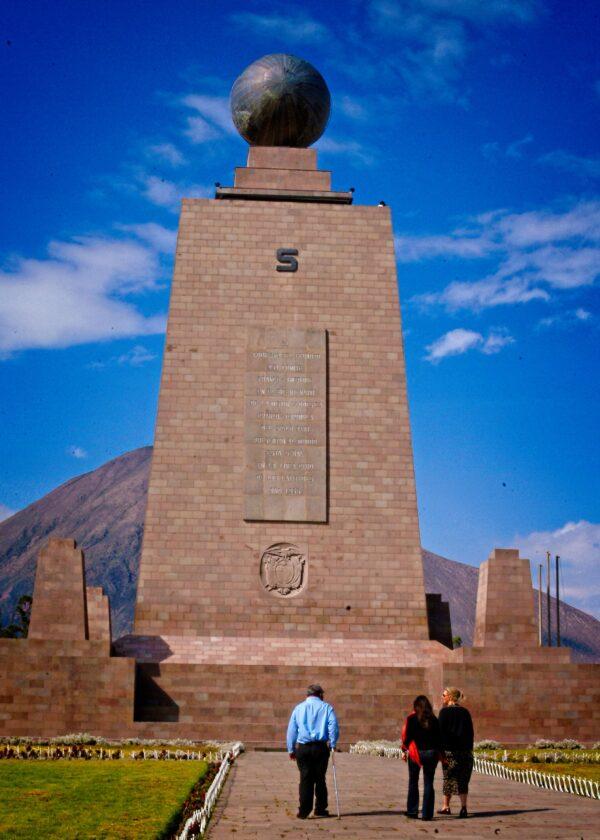 The equator lies only 16 miles north of Quito. This structure marks its location. Ecuador is one of only a couple places in the world where you can see snow-capped mountains while standing at the equator. (Copyright Fred J. Eckert)