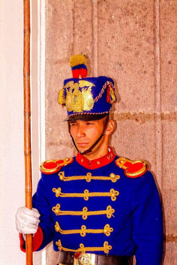 Guards at the presidential palace in Quito wear colorful 19th-century uniforms. (Copyright Fred J. Eckert)