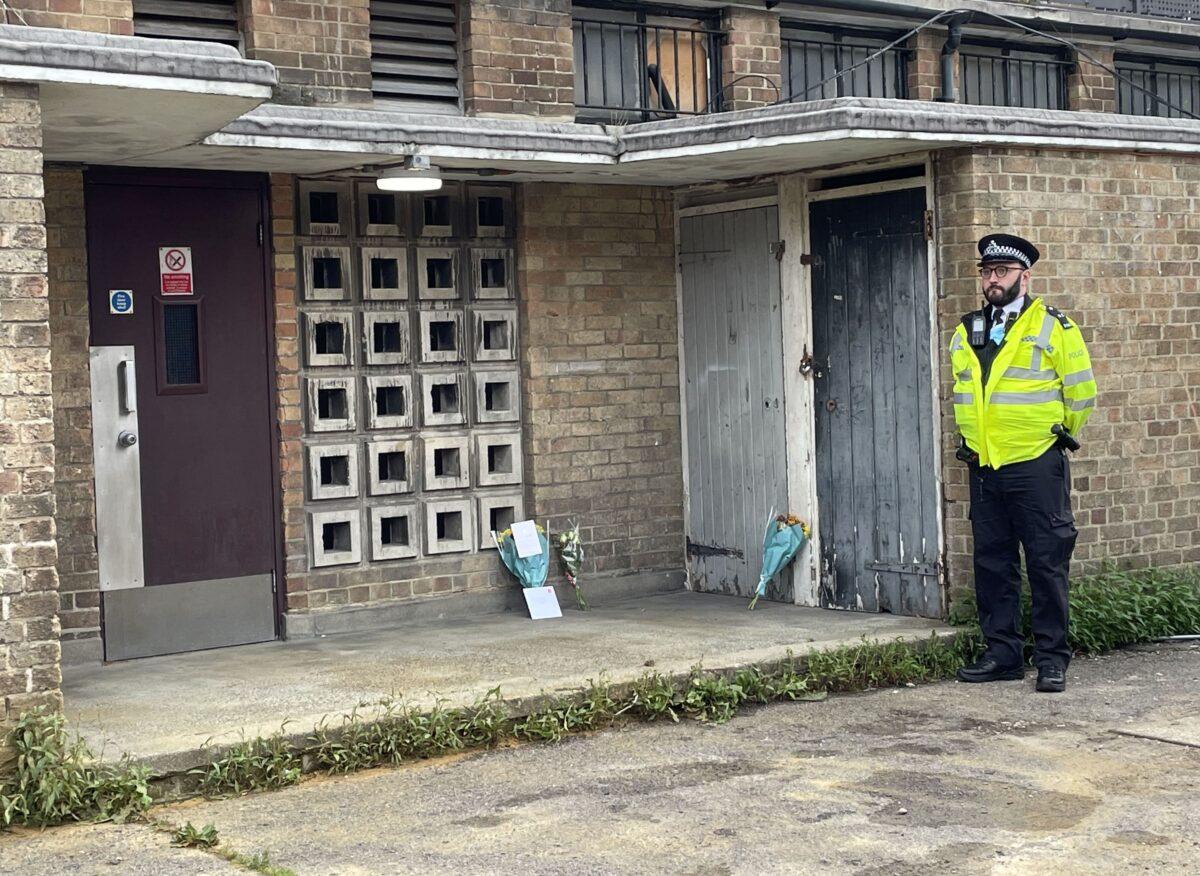 Police at the scene where 45-year-old James Markham was stabbed to death on Monday, in Churchill Terrace, Chingford, east London, on Aug. 12, 2021. (Laura Parnaby/PA)