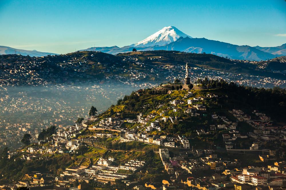The statue of the Virgin of El Panecillo overlooks the heart of Quito. Cotopaxi stands in the background. (Ecuadorpostales/Shutterstock)