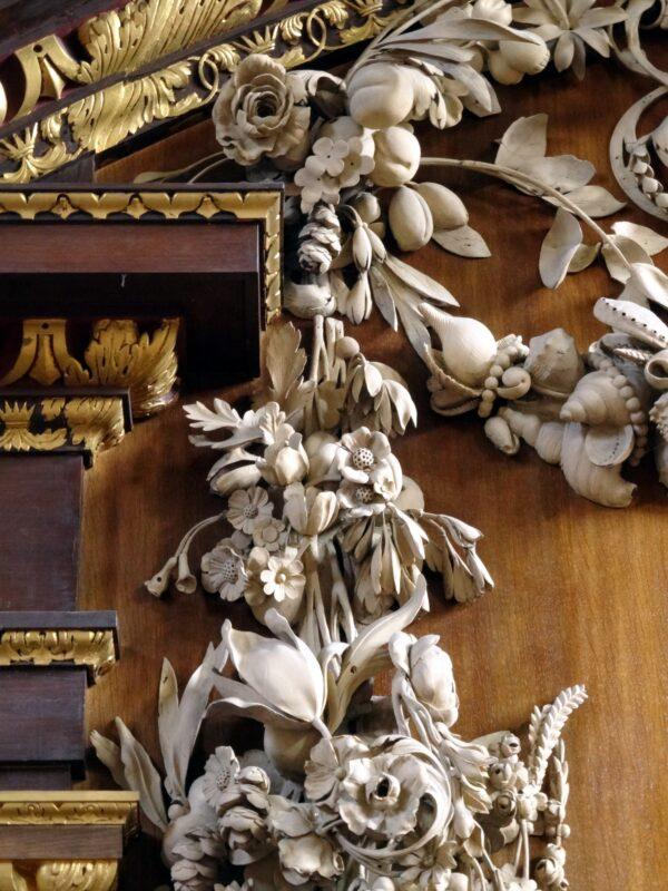 The reredos (a large decorative piece behind the altar) showing limewood carvings of flowers, shells, and strings of pearls, by Grinling Gibbons, pictured from below at St James’s, Piccadilly, London. (Bob Easton)